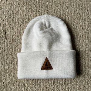White knit toque with label